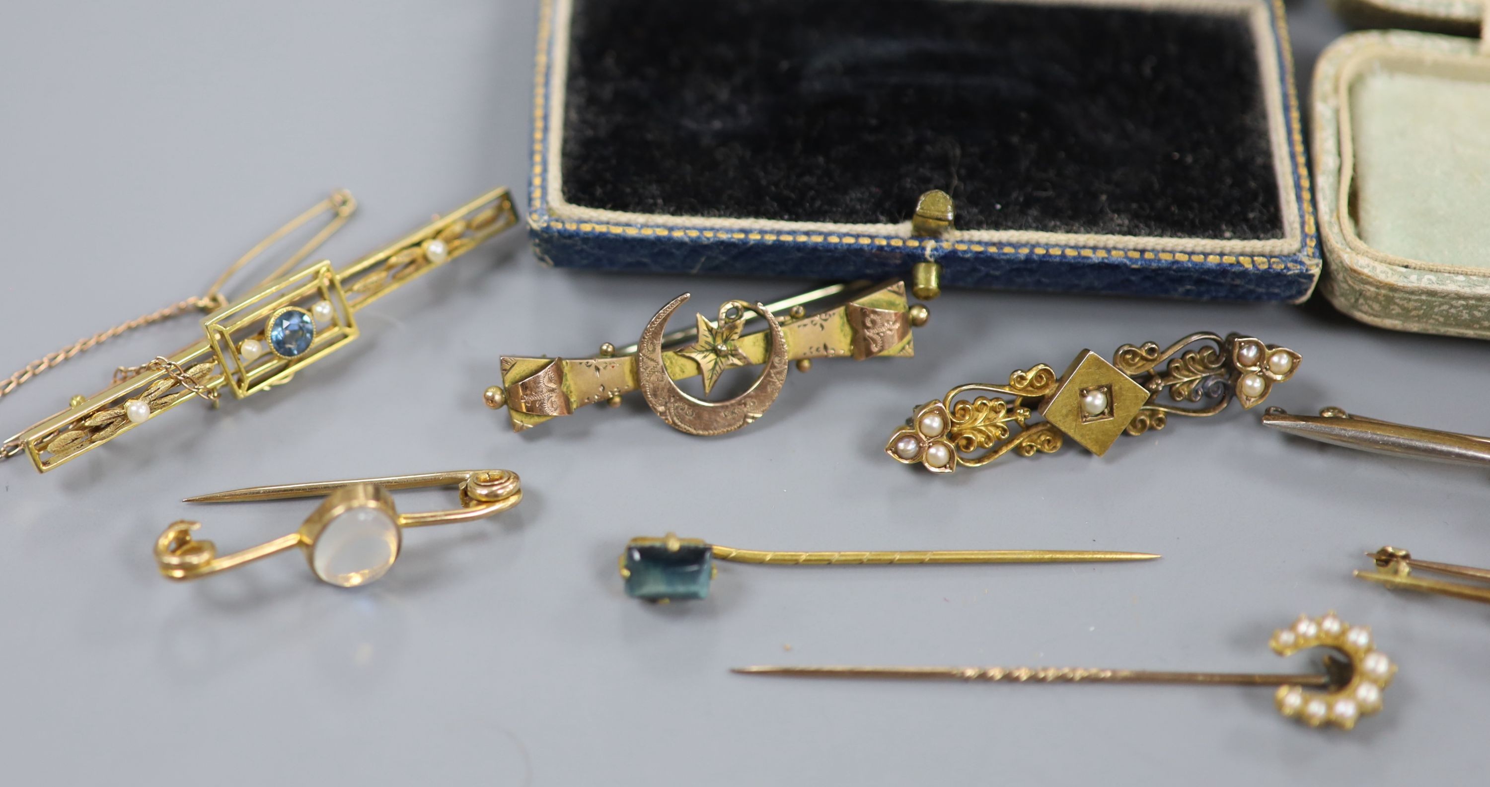 Two Edwardian 15ct and gem set bar brooches, including sapphire and seed pearl, gross 7.4 grams, three 9ct and gem set bar brooches, gross 6.1 grams, four yellow metal and gem set bar brooches, gross 10.4 grams, two yell